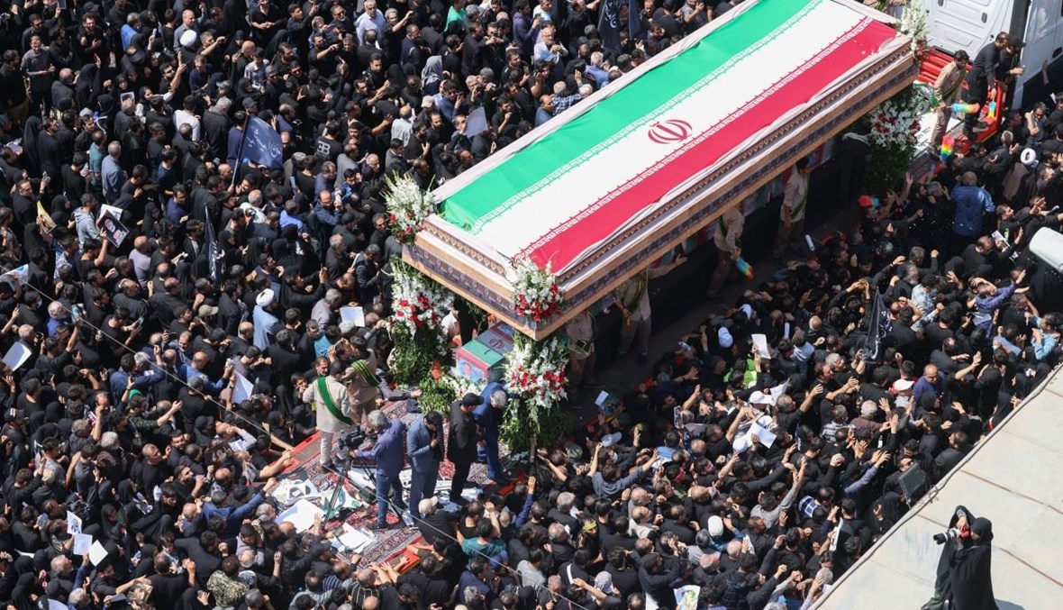 ​الرئيس الإيراني يوارى الثرى في مشهد مسقط رأسه